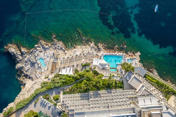 Aerial view of the Hotel Dubrovnik Palace pools and rocky shore