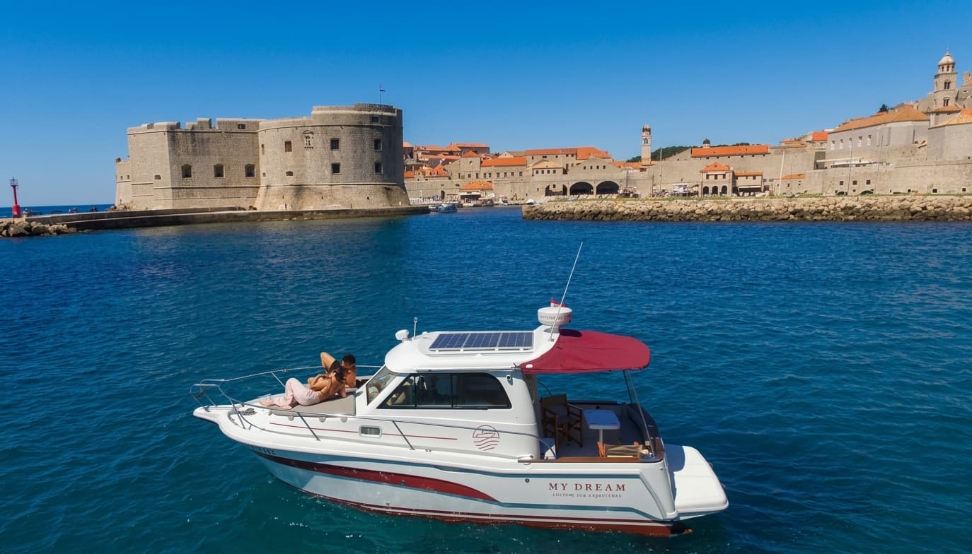 The My Dream boat in front of the Dubrovnik city walls